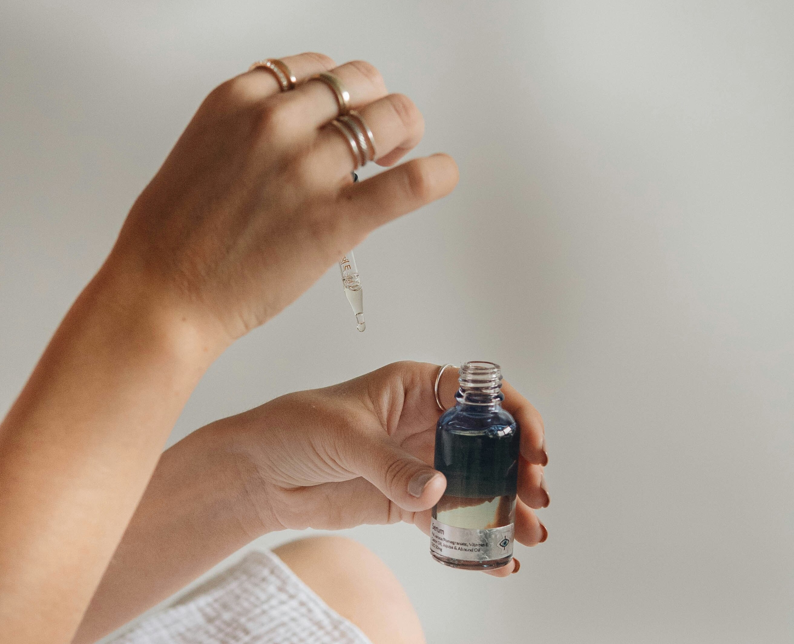 mathildelangevin holding black glass bottle cropped